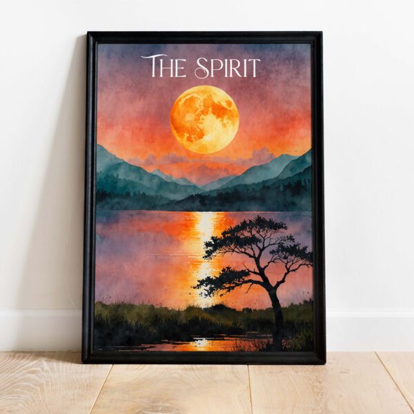 A wall frame featuring a vibrant sunset over a lake with a silhouetted tree and distant mountains, accompanied by the motivational text "The Spirit."